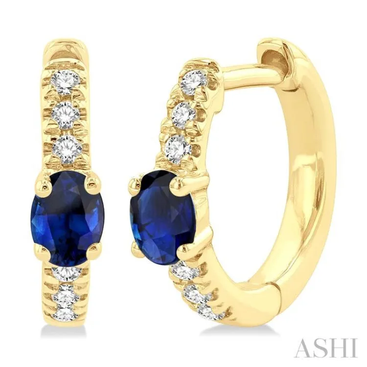 1/10 ctw Petite 4X3MM Oval Cut Sapphire and Round Cut Diamond Fashion Huggies in 10K Yellow Gold