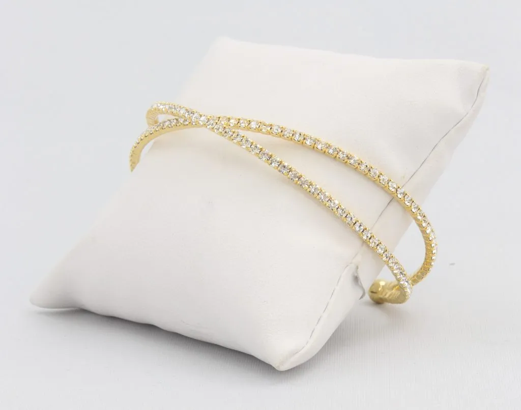 Criss-cross bracelet with inlaid simulated diamonds