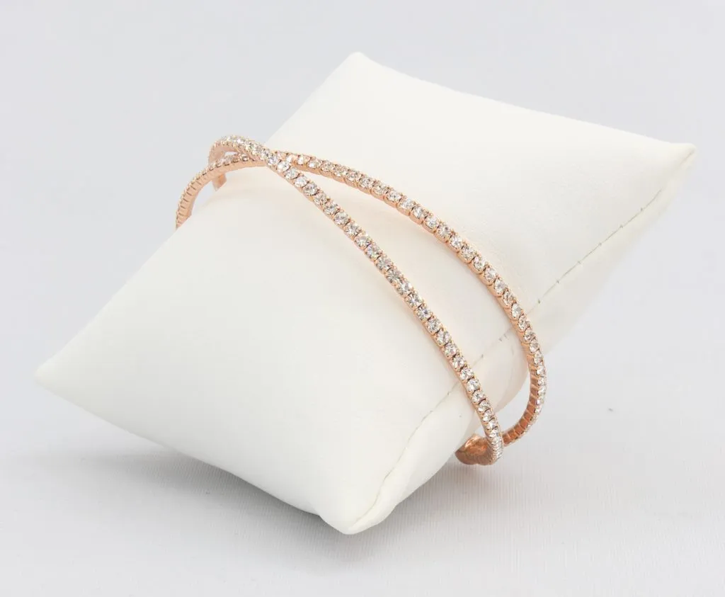 Criss-cross bracelet with inlaid simulated diamonds