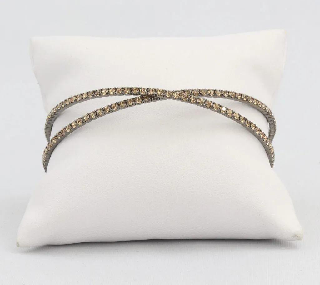 Criss-cross bracelet with inlaid simulated diamonds