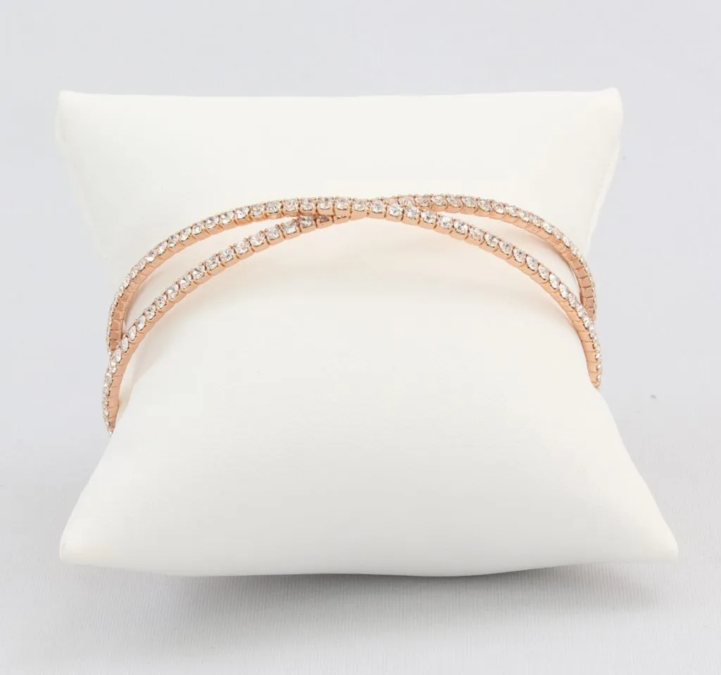 Criss-cross bracelet with inlaid simulated diamonds