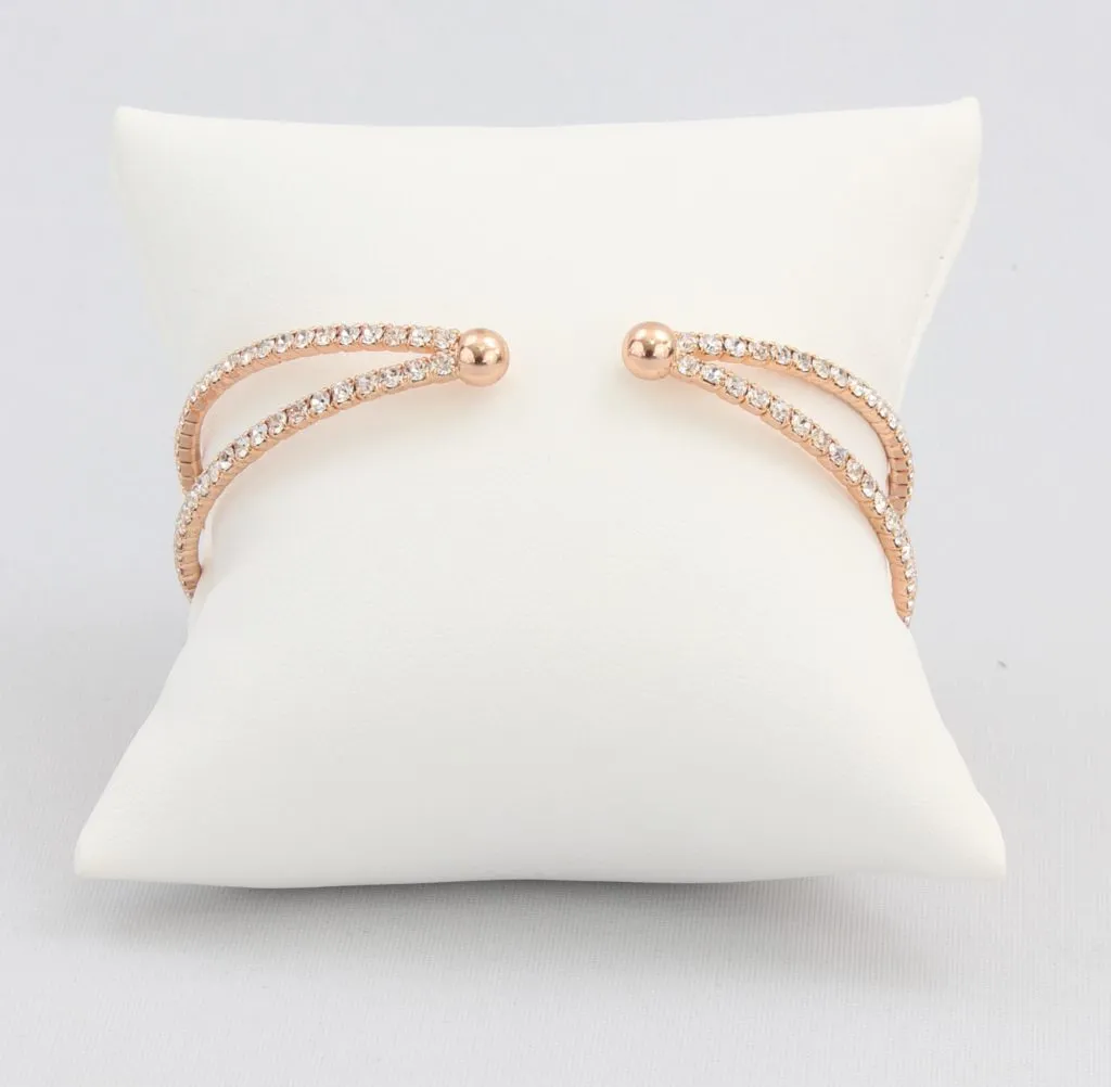 Criss-cross bracelet with inlaid simulated diamonds