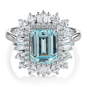 Dress ring with 9x7mm aquamarine simulant and 1.43 carats* of diamond simulants in 10 carat white gold